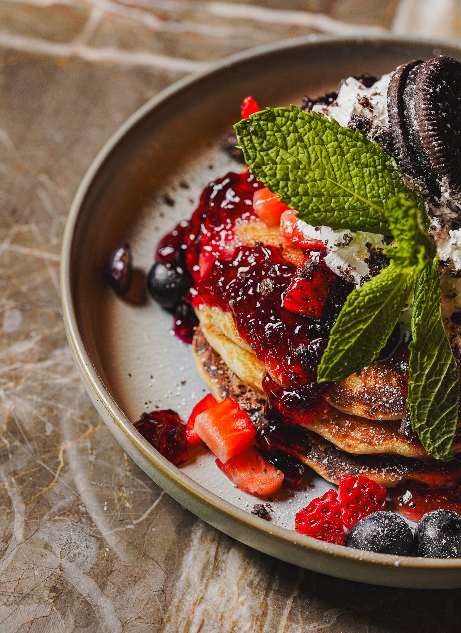 Close-up detail of plated gourmet toast with fresh, vibrant toppings