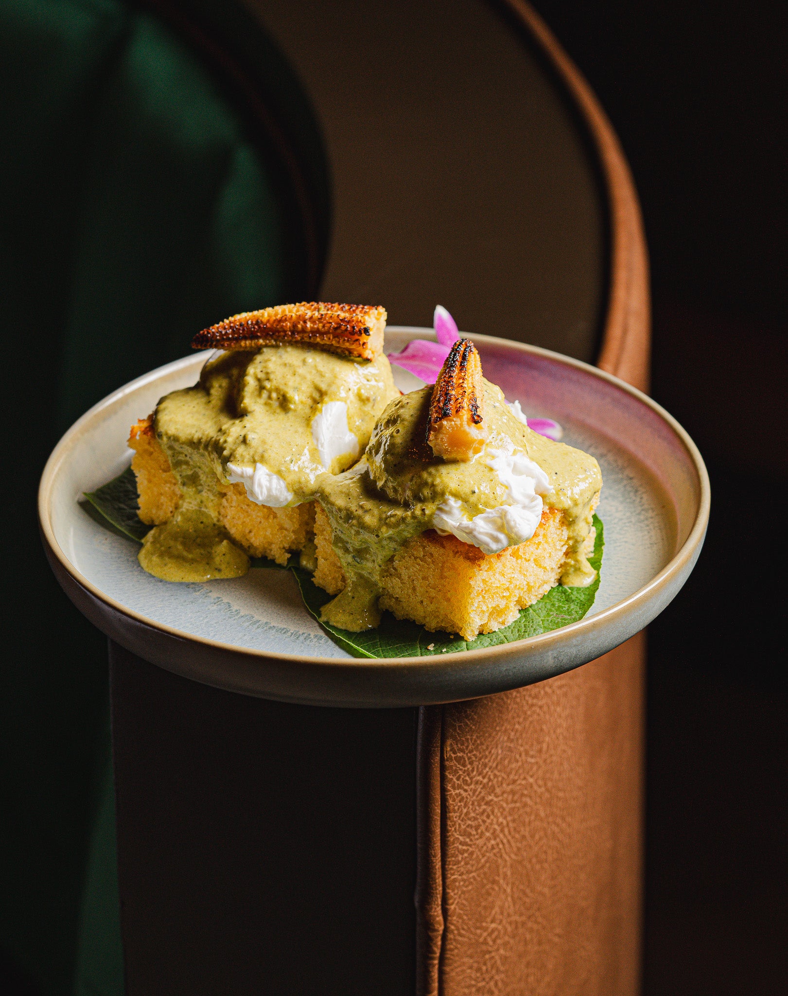 Overhead shot of refined brunch dishes with pastel tones at Casa Matilda